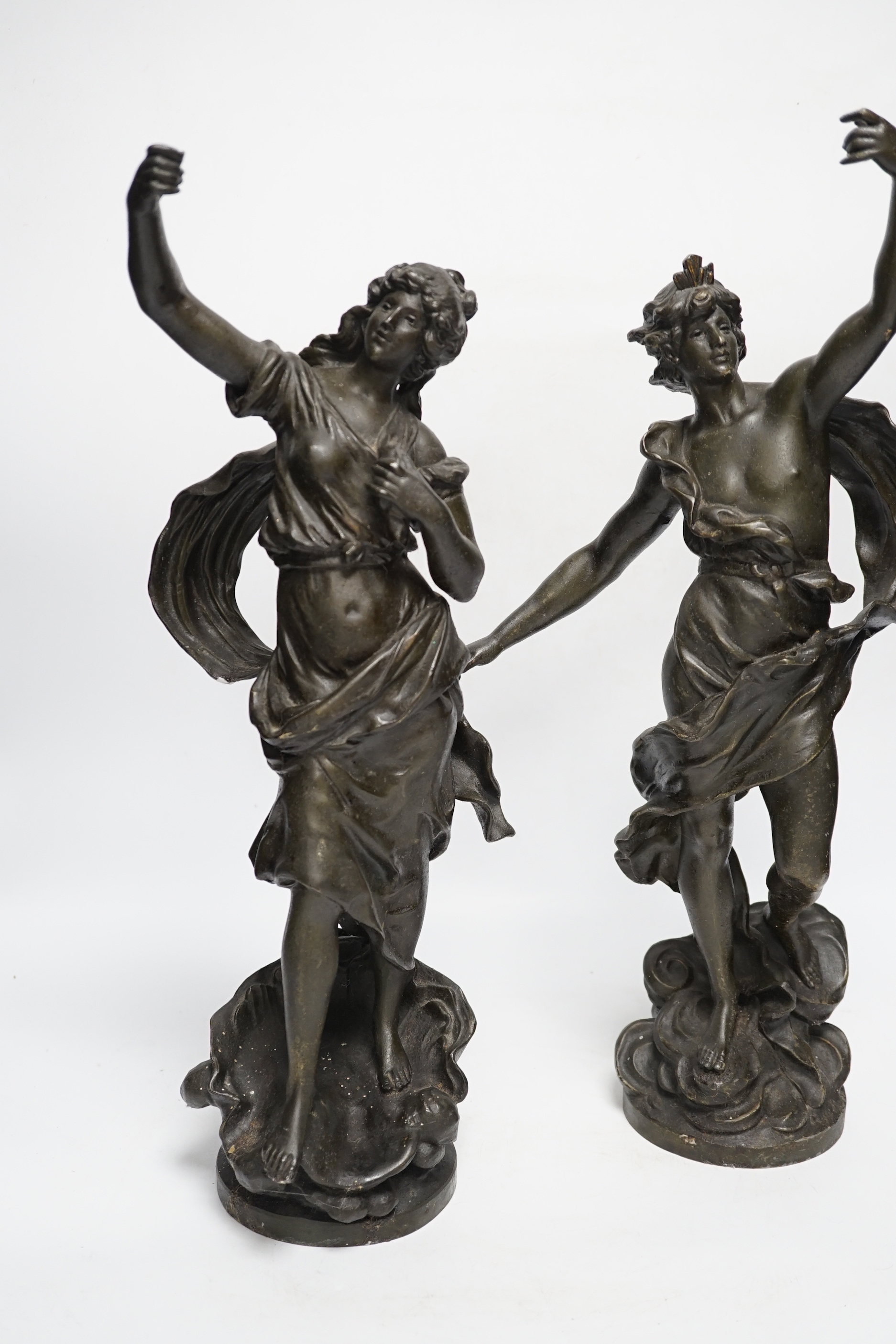 A pair of patinated spelter figures, 47cm